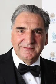 Jim Carter as Charles Carson